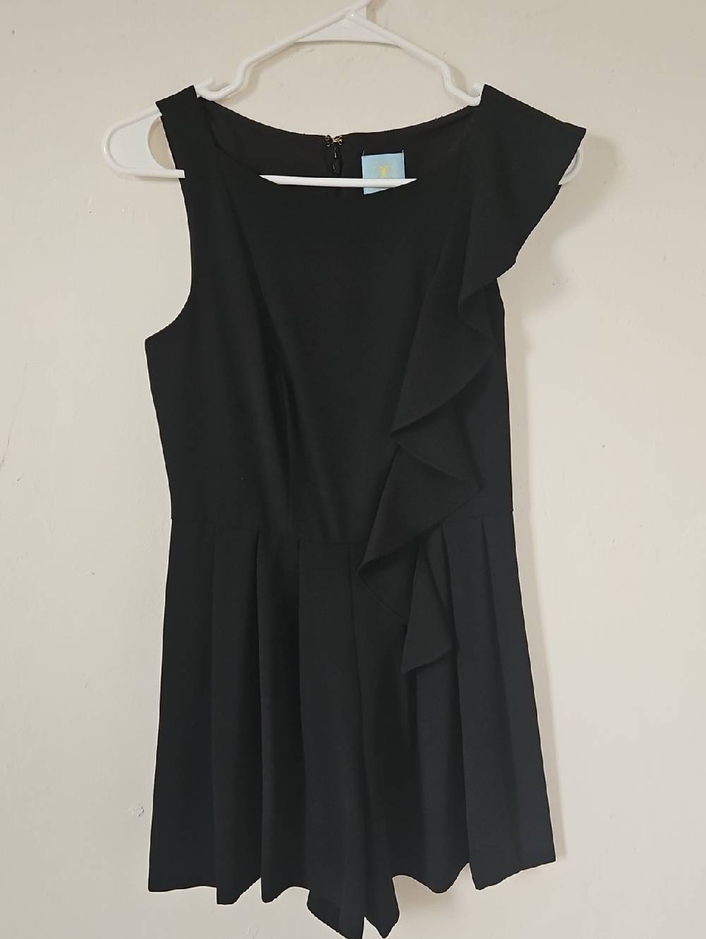 CeCe Black Asymmetrical Ruffle Romper.
